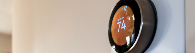 smart thermostat on wall set to 74 degrees