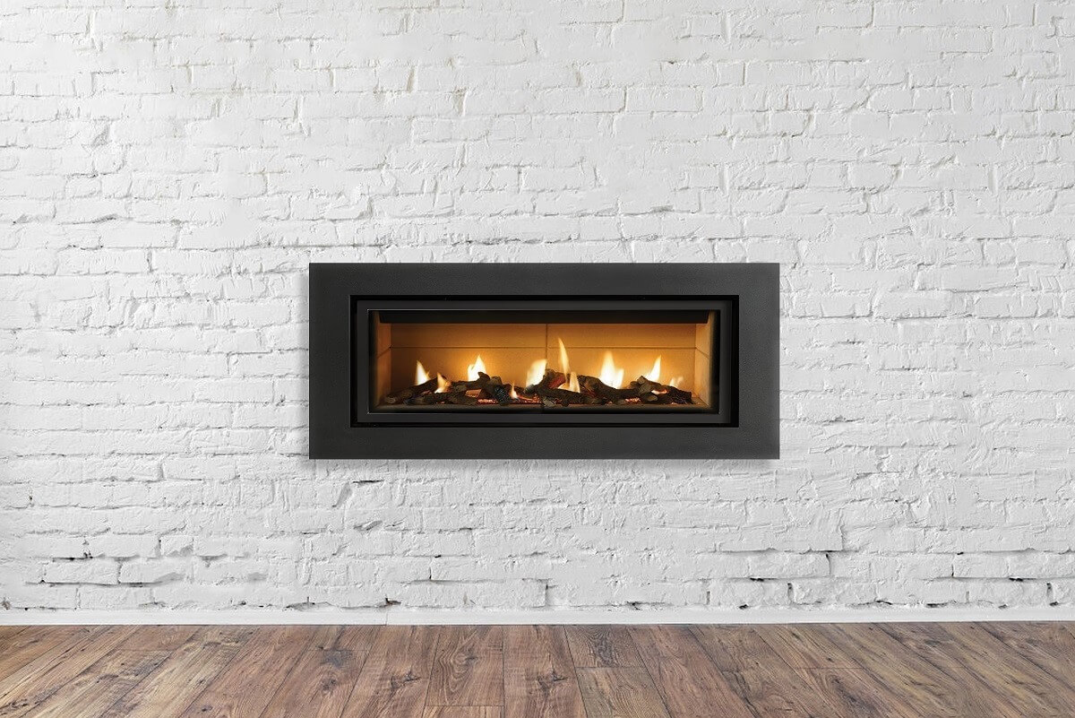 Gas fireplace in white brick wall
