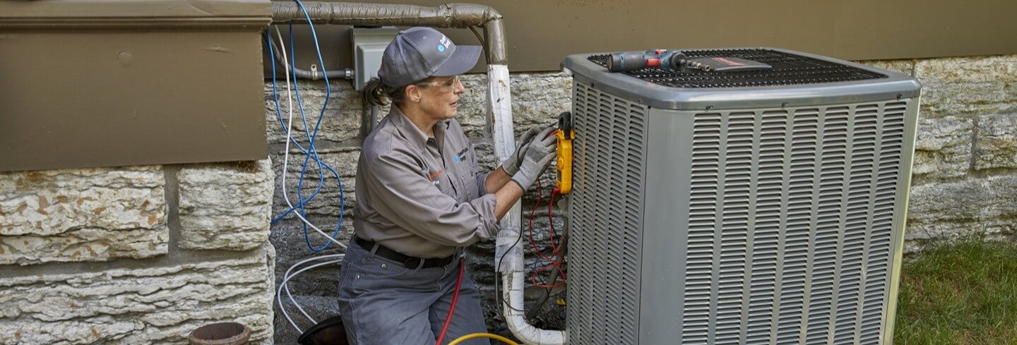HSP technician performing HVAC maintenance