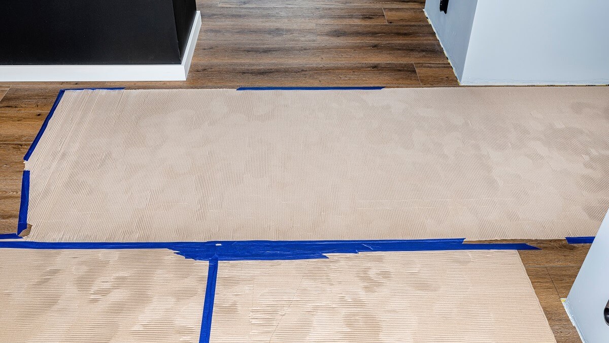 Corrugated cardboard to protect floor during HVAC install